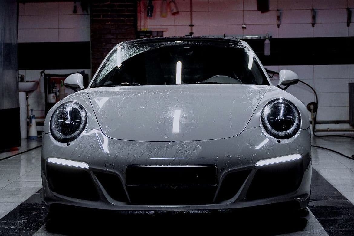 The 911 head-on, between the bay's curtains.
