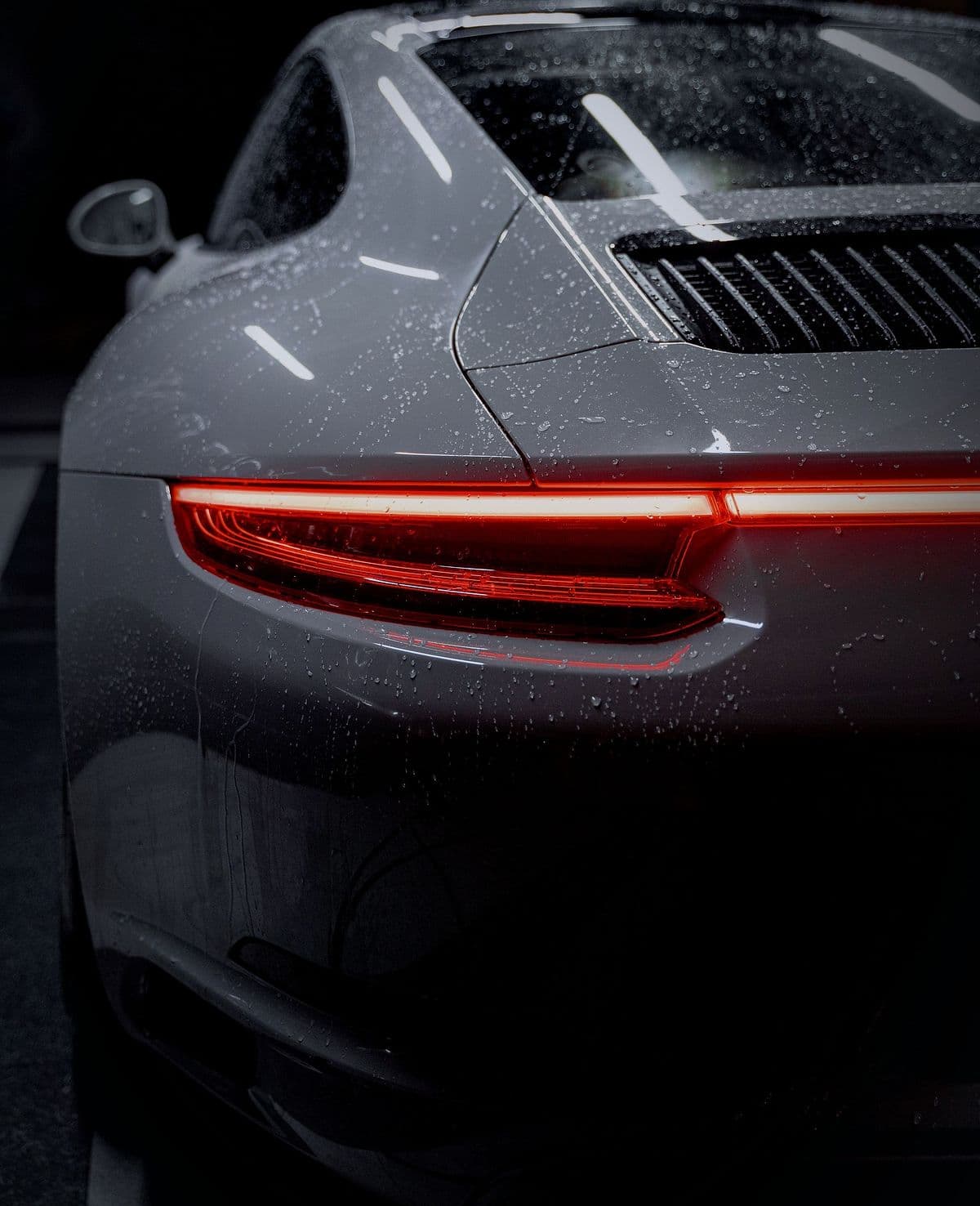 The 911's rear haunch and full-width tail-light strip.