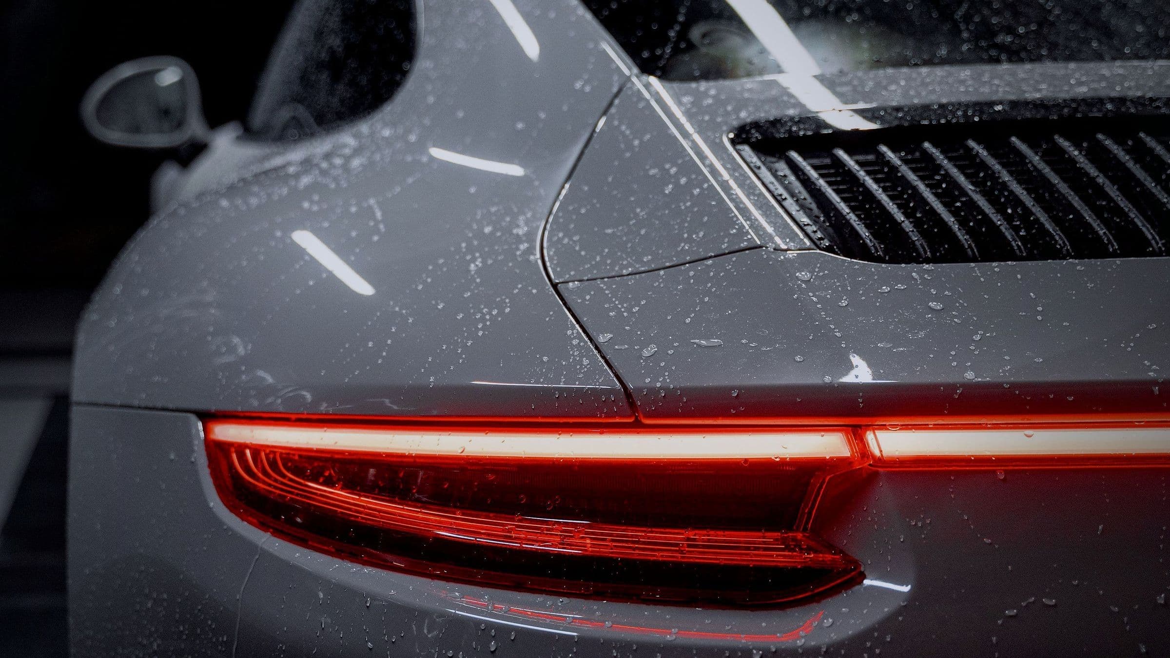 The 911's rear haunch and full-width tail-light strip.