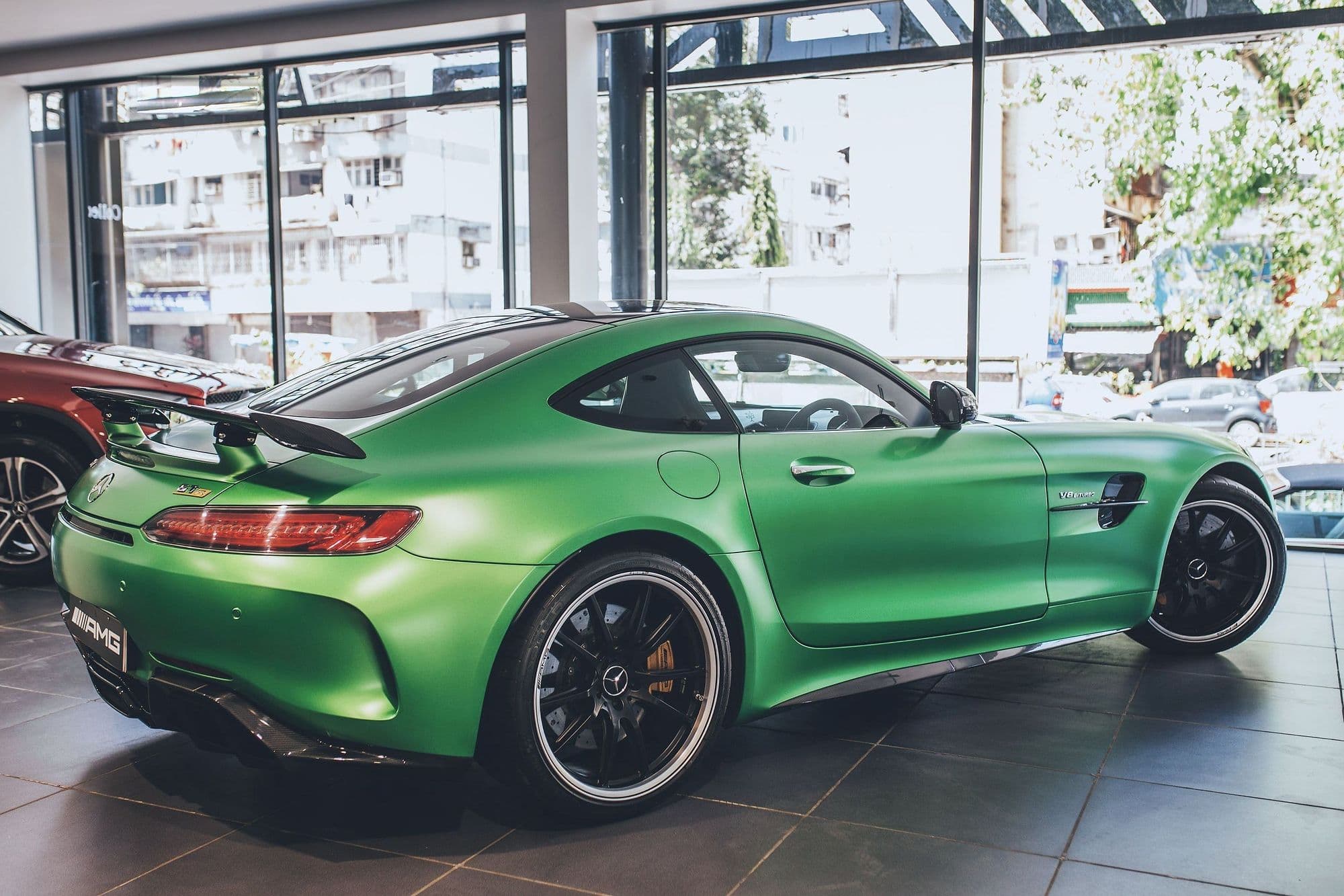 The GT R from behind: the fixed rear wing and the tail lights, by the showroom windows.