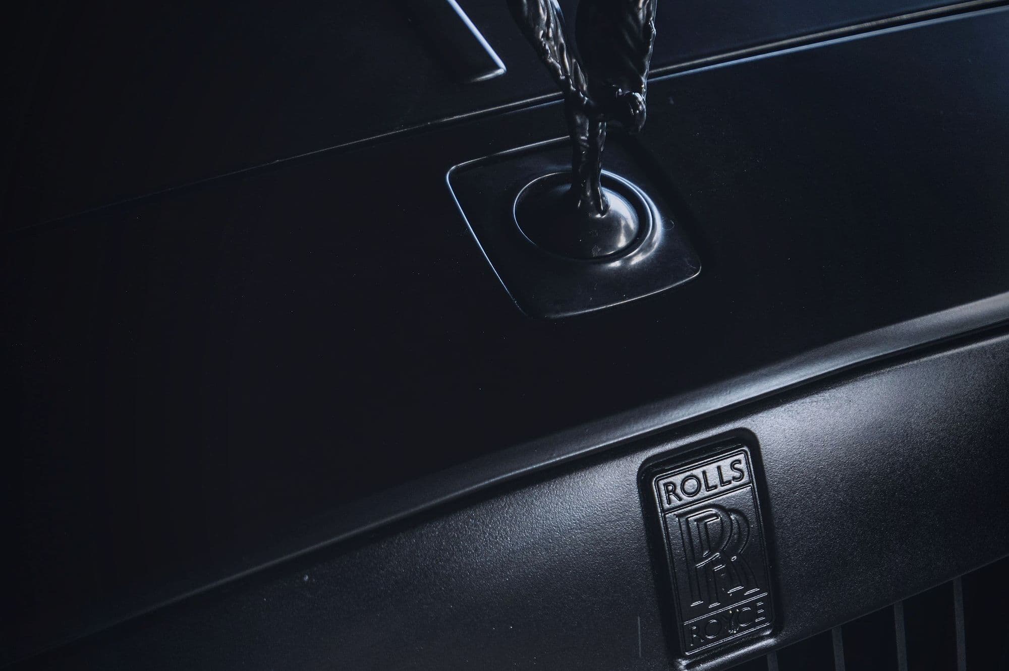The Ghost's bonnet mascot and grille badge in satin black.